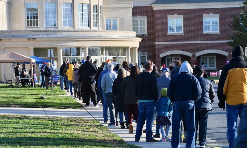 Even with a large surge in mail-in ballots, lines are long at polling places, such as Cape Henlopen High School, all day and into the night during the Nov. 3, 2020, general election.